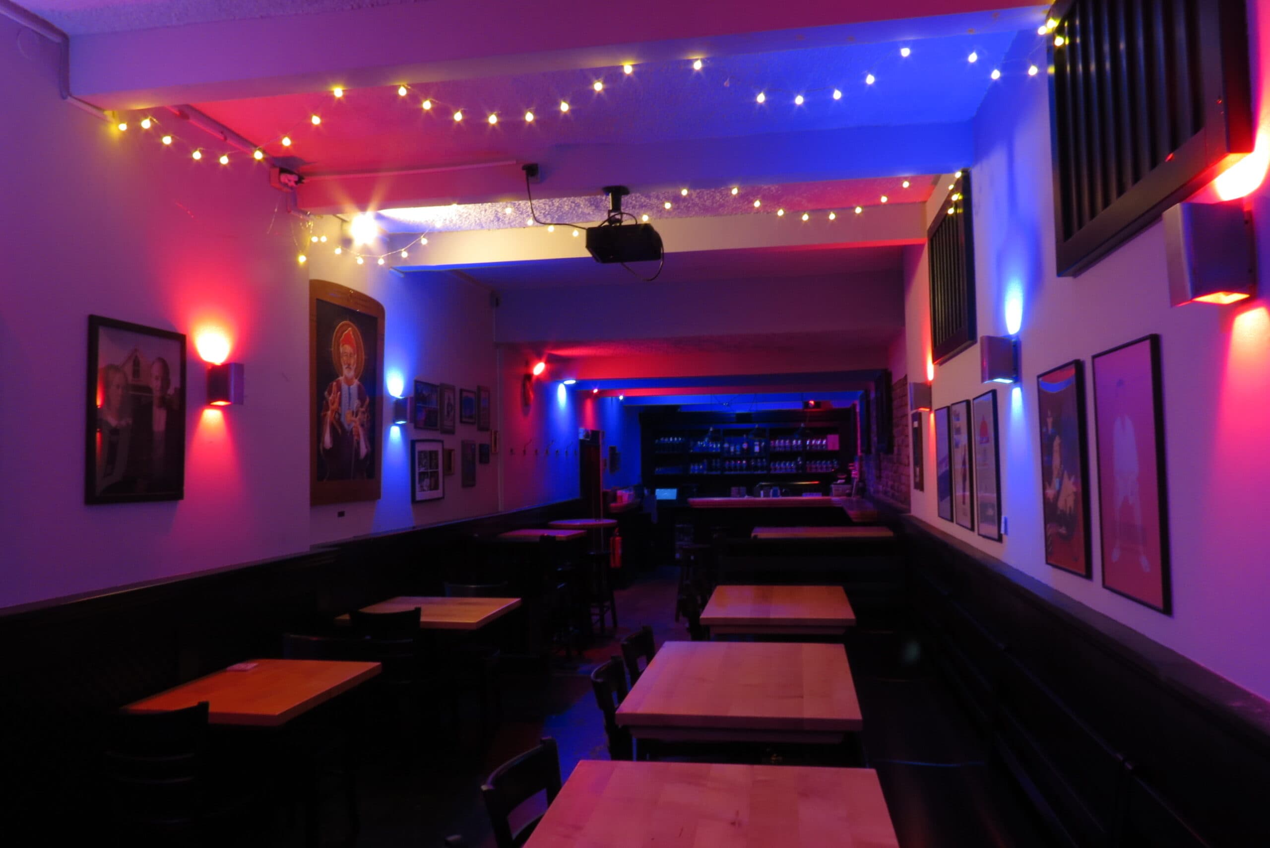 The empty function room with brick wall, wooden floor and its own bar